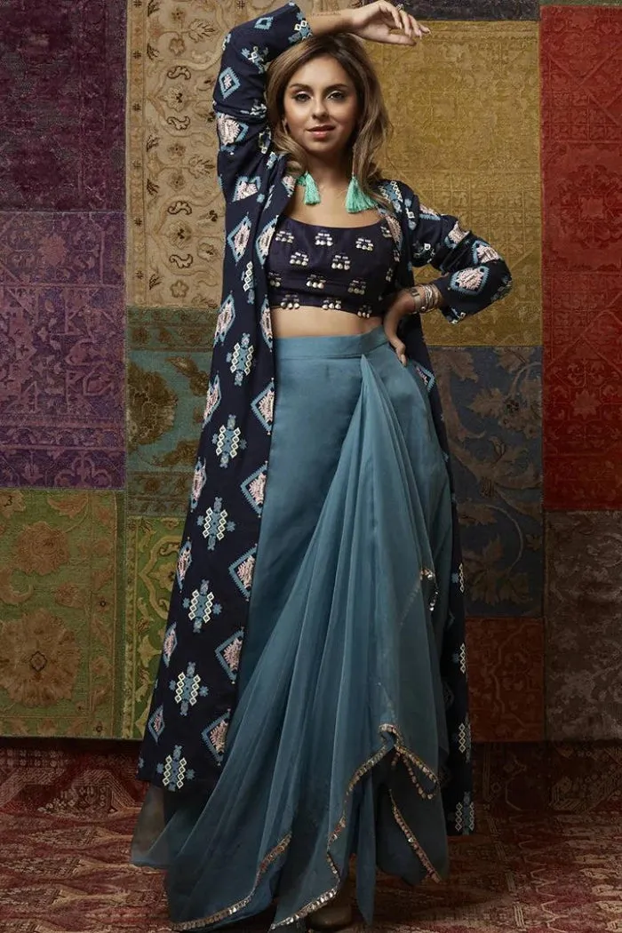 TEAL BLUE ORGANZA DRAPE SKIRT PAIRED WITH BUTTI EMBROIDERY AND A PRINTED DENIM JACKET